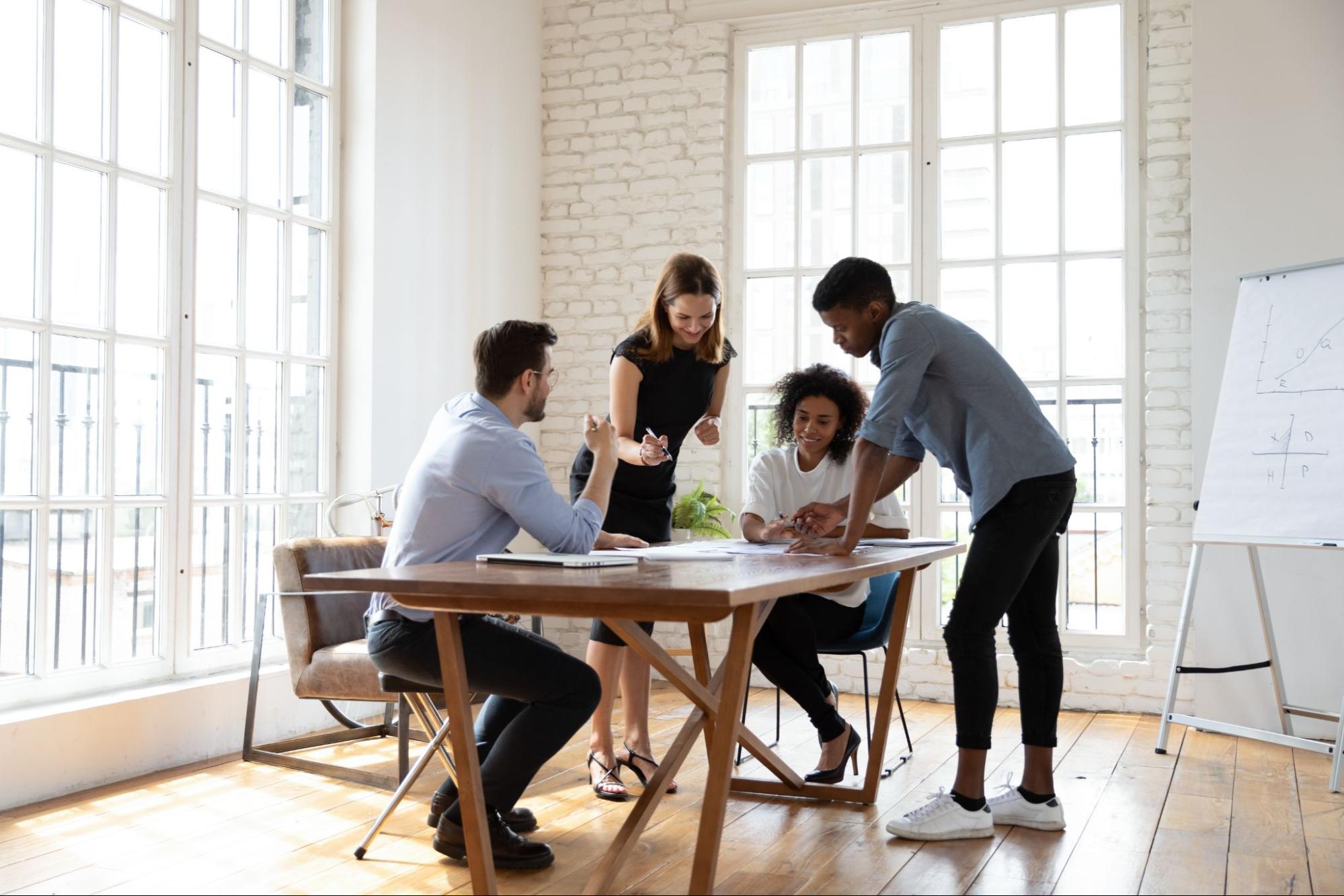 A collaborative business growth consulting session at Evolved discussing how to implement a synchronized Attract, Convert, and Engage marketing pipeline.